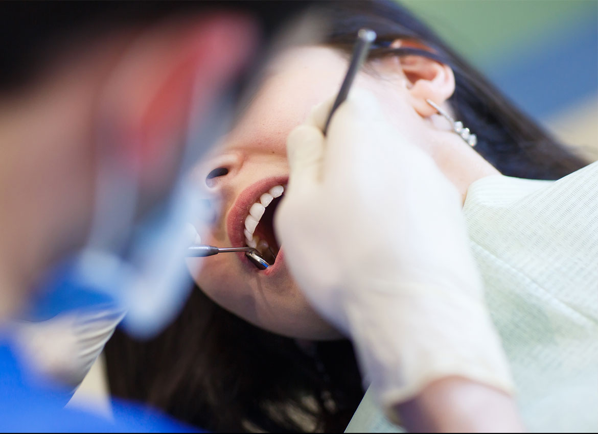 dentist performing crown procedure to a patient